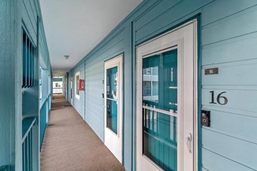 a hallway of a building with a number on it at Hang Ten Hideaway, pool, Condo, Parking - 6 person max occupancy in Carolina Beach