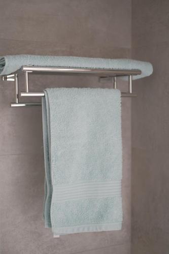 two towels on a towel rack in a bathroom at Eblana House in Dublin