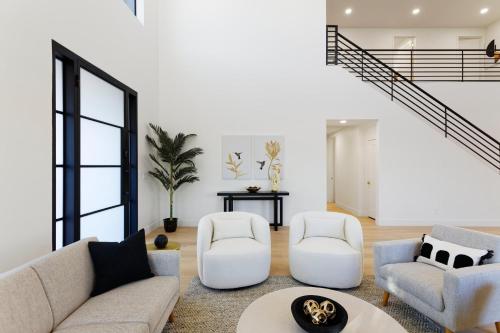 a living room with two couches and two chairs at LUXE - Nouveau - Sparkling Pool - Walk to Old Town in Scottsdale