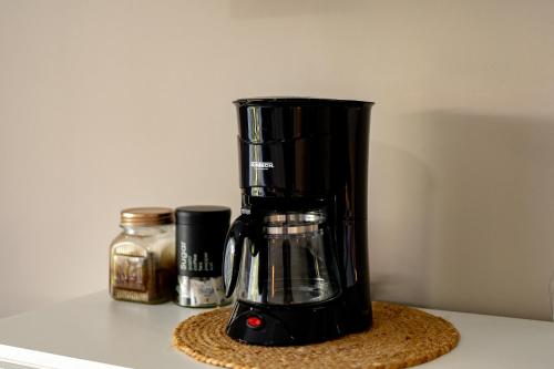 a black blender sitting on top of a counter at House of Turri Suite Views Terrace & Jacuzzi in Verbena Norte