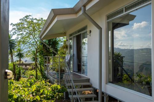 a house with a balcony with a view of the mountains at House of Turri Suite Views Terrace & Jacuzzi in Verbena Norte