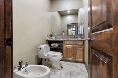 a bathroom with a toilet and a sink at Entertainment Castle - Large Group & Company Func in Meridian