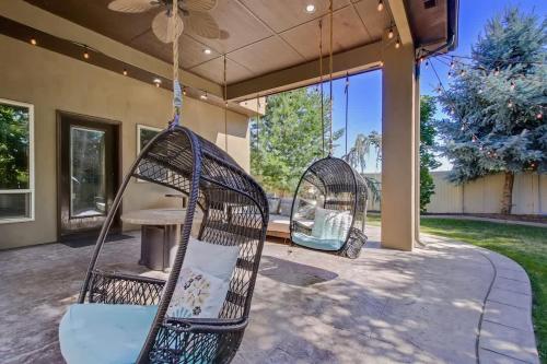 two wicker chairs hanging from a porch swing at Entertainment Castle - Large Group & Company Func in Meridian