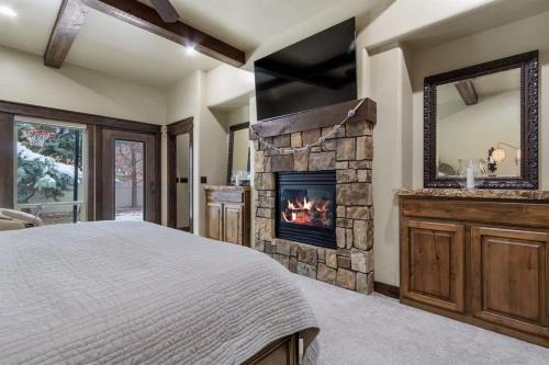 a bedroom with a fireplace and a bed at Entertainment Castle - Large Group & Company Func in Meridian