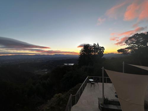 a view of the sunset from a house balcony at Montebello Views in Cupertino