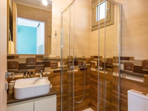 a bathroom with a sink and a shower at Villa in Armenoi near Rethymno Beaches in Fotinós