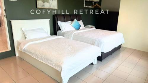 Ένα ή περισσότερα κρεβάτια σε δωμάτιο στο CofyHill Retreat