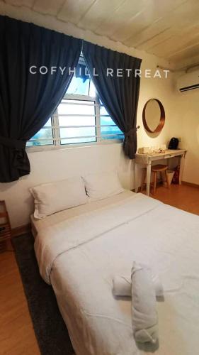 Ένα ή περισσότερα κρεβάτια σε δωμάτιο στο CofyHill Retreat