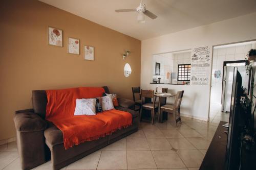 a living room with a couch and a table at Villa Rio in Brotas