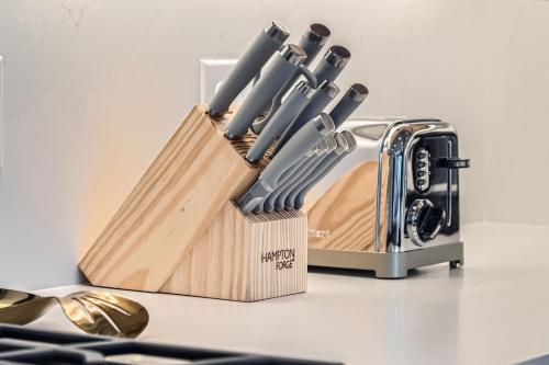 a knife block filled with knives on top of a counter at Flying Moose at Helling Circle 101 condo in Heber City