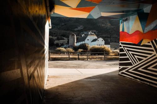 a hallway with a painting on the side of a building at Flying Moose at Helling Circle 101 condo in Heber City