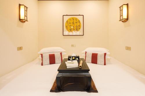 Postel nebo postele na pokoji v ubytování Yunjincheng Mansion