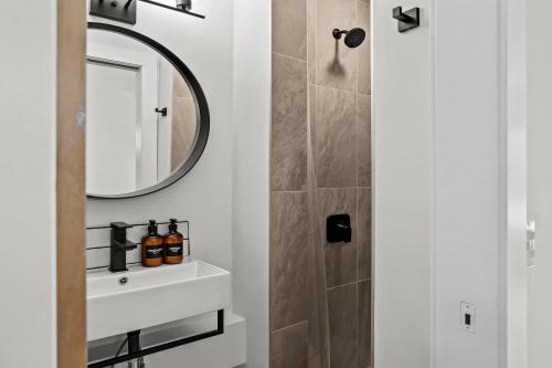 a bathroom with a sink and a mirror at 2BR 2BA Harvie Heights Townhouse retreat with views in Canmore