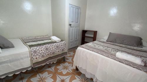 Postel nebo postele na pokoji v ubytování Hotel Marjenny