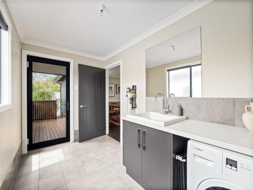 a kitchen with a sink and a dishwasher at Greenview in Margaret River Town