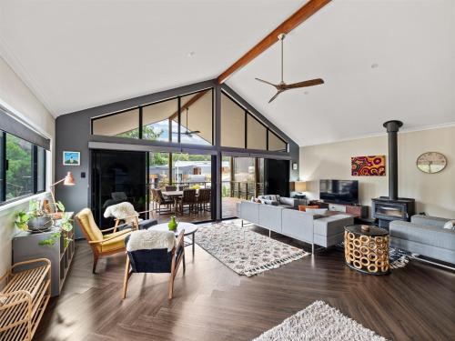 a living room with a couch and a table at Greenview in Margaret River Town