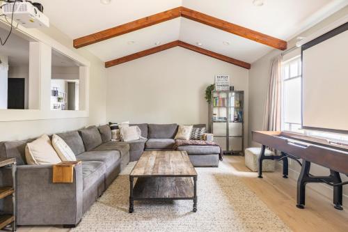a living room with a couch and a piano at Montebello Views in Cupertino