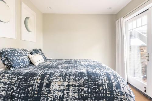 a bedroom with a bed and a window at Montebello Views in Cupertino