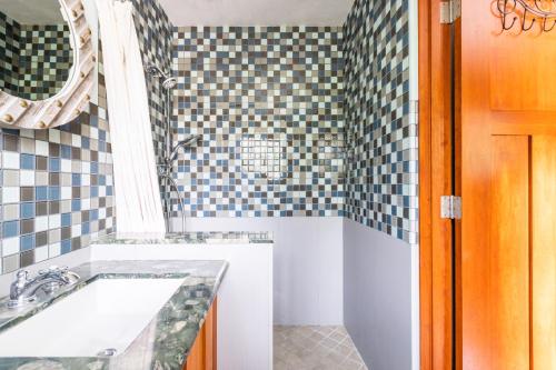 a bathroom with a sink and a mirror at Montebello Views in Cupertino