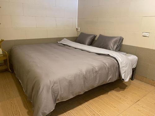 a large bed in a small room with at Lee's House in Dong Anh