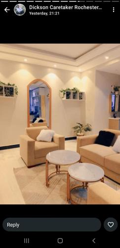 a living room with a couch and a table at Ahwera beautiful homes in Kampala