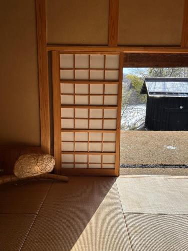 an entrance to a room with an open door at 風の沢 in Kurihara