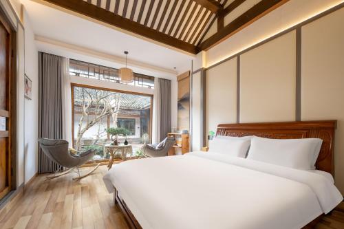 Ένα ή περισσότερα κρεβάτια σε δωμάτιο στο Chengdu jinfu hotel