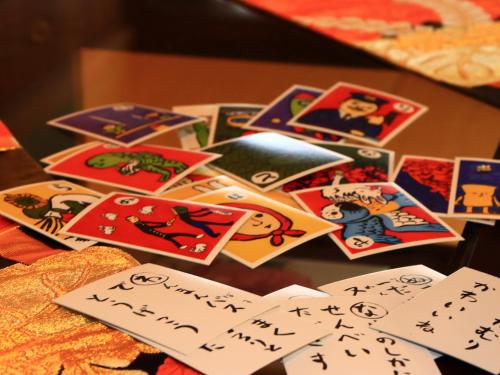 a pile of stickers on top of a table at Azumino Salon in Azumino