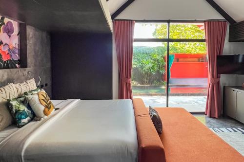 Postel nebo postele na pokoji v ubytování Tolani Resort Koh Samui