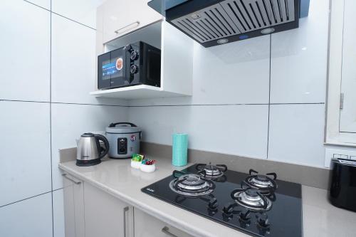 Dapur atau dapur kecil di Maskan by Rafiqi Estates - Deluxe 2BHK & Studio Apartments