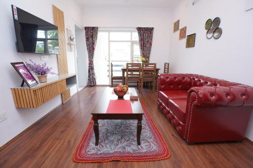 Televisyen dan/atau pusat hiburan di Maskan by Rafiqi Estates - Deluxe 2BHK & Studio Apartments