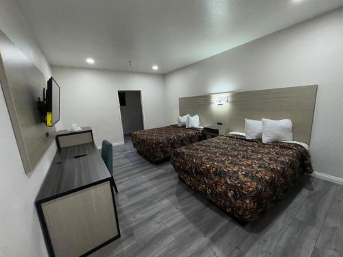 Ένα ή περισσότερα κρεβάτια σε δωμάτιο στο Five Star Inn