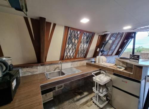 a kitchen with a sink and a counter top at My Cabin by One Selah in Bustos