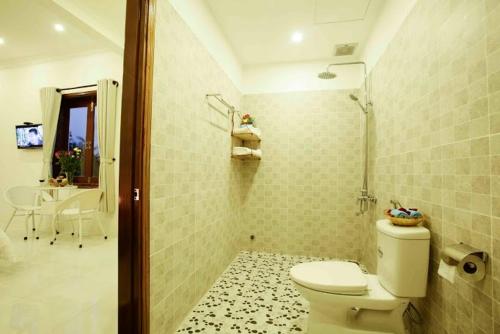 Vannituba majutusasutuses Coconut Garden Homestay