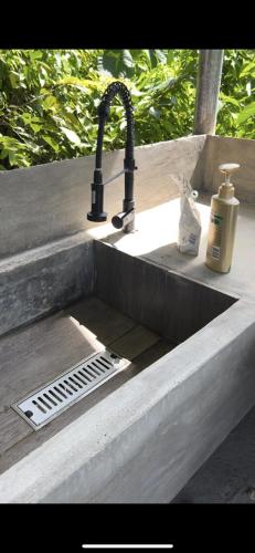 a sink with aaucet and a drain in it at SUMMER STAY A Starlink in General Luna