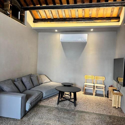 a living room with a couch and a table at 老宅拾光Lao Shih Kuang-預訂後聯繫才會保留 in Tainan