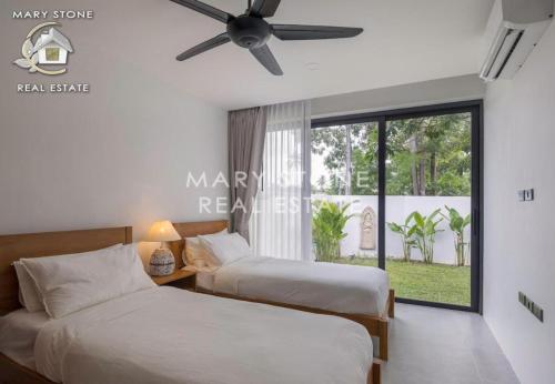 Katil atau katil-katil dalam bilik di Villa Aurora - Modern 3BR Pool Villa