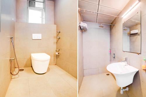 a bathroom with a toilet and a sink at The Unicontinental in Mumbai