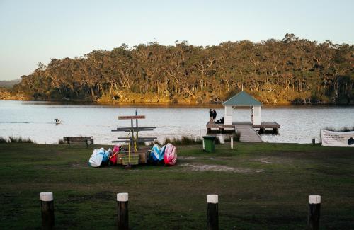 a park with a playground next to a lake at Walpole Rest Point Caravan Park in Walpole