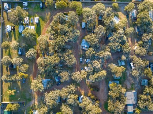 an aerial view of a parking lot with trees at Lazy Days Caravan Park in Vasse