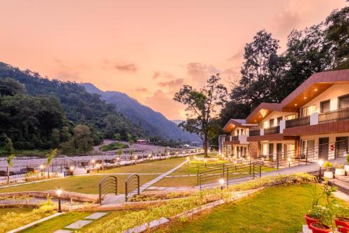 a resort with a view of the mountains at DLS Divine River Resort and Spa, Rishikesh in Rishīkesh