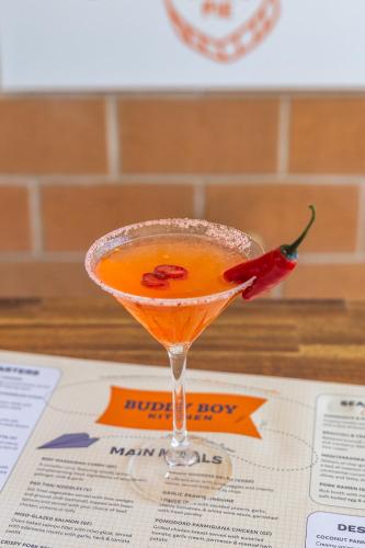 a cocktail sitting on top of a menu at Parkes International in Parkes