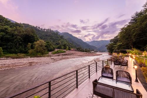 a view of a river from a bridge at DLS Divine River Resort and Spa, Rishikesh in Rishīkesh