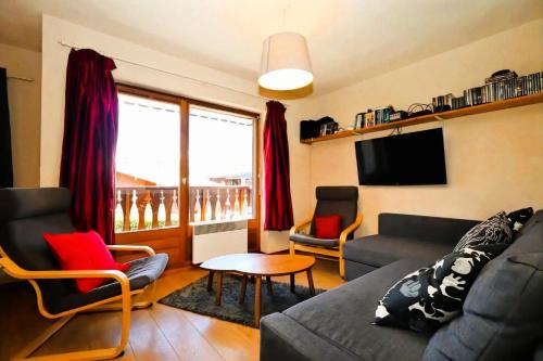 a living room with a couch and chairs and a tv at Résidence Les Houches Villages - Houches Village B23 MAE-6424 in Les Houches