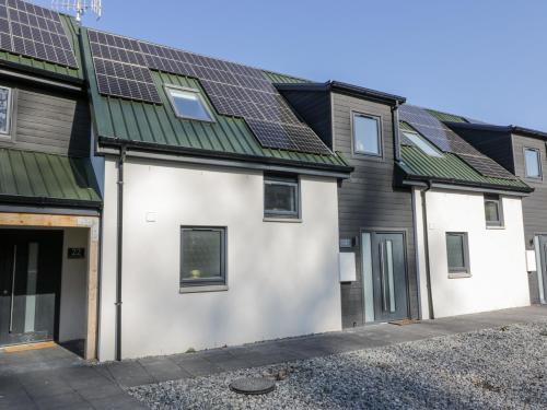 a house with solar panels on the roof at Tay View in Aberfeldy