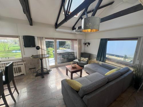 a living room with a couch and a table at Haus an der Heide in Itterbeck