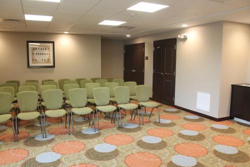 a conference room with a row of chairs and a podium at Staybridge Suites Carlsbad/San Diego by IHG in Carlsbad