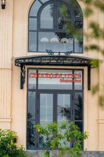 a sign on the front of a building with a window at Belliss Hotel And Spa Dai Lai in Phúc Yên