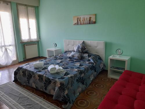 a bedroom with a large bed with two tables at Appartment Lago e Natura in Sandra