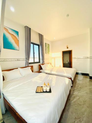 Katil atau katil-katil dalam bilik di Jayden Hotel - Phú Quý